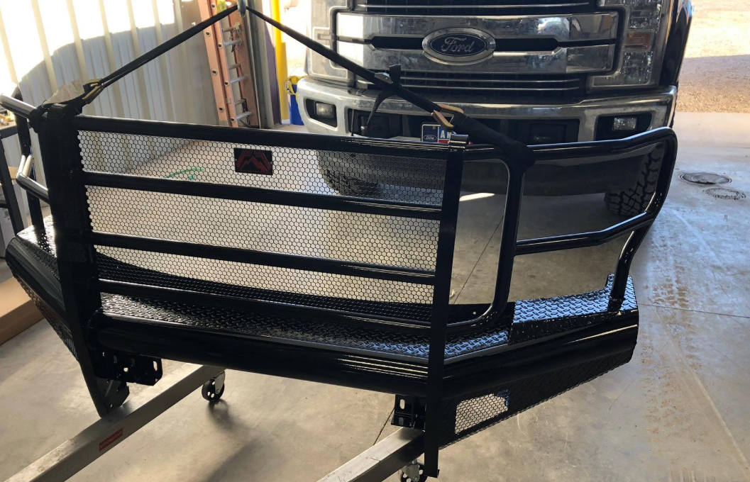Custom black front bumper on a Ford truck